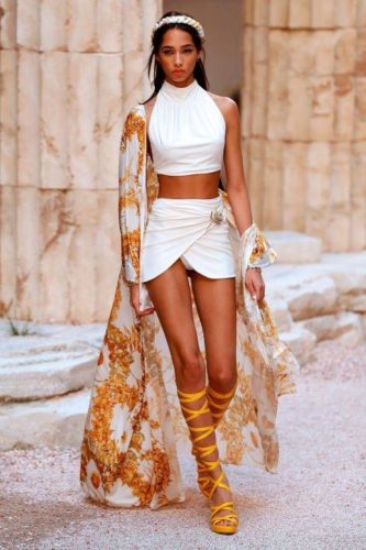 White top and short skirt with semitransparent coat Chanel resort 2018 Greek Goddess