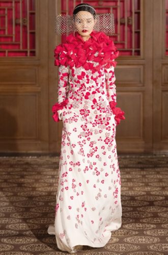 White gown with red flowers and bows Valentino Haute Couture Collection in Beijing